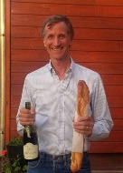 Tom with wine and bread